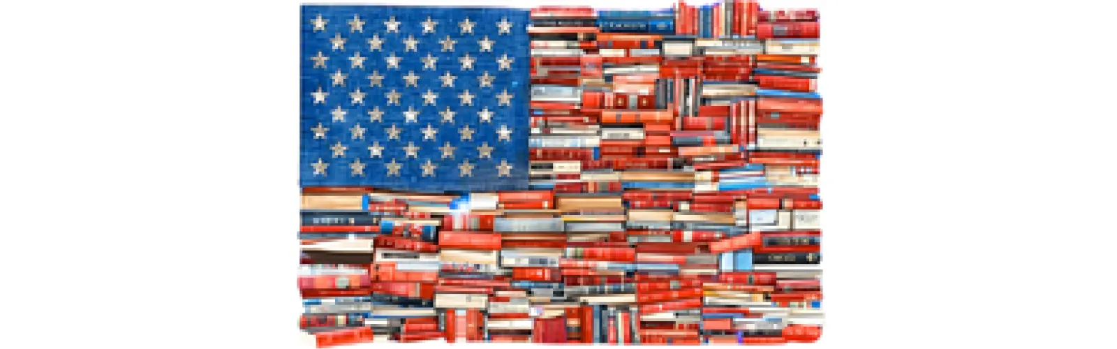 An American flag made from stacked books. Blue books with white stars form the upper left, while red and white spines create the stripes. Creative and patriotic tone.