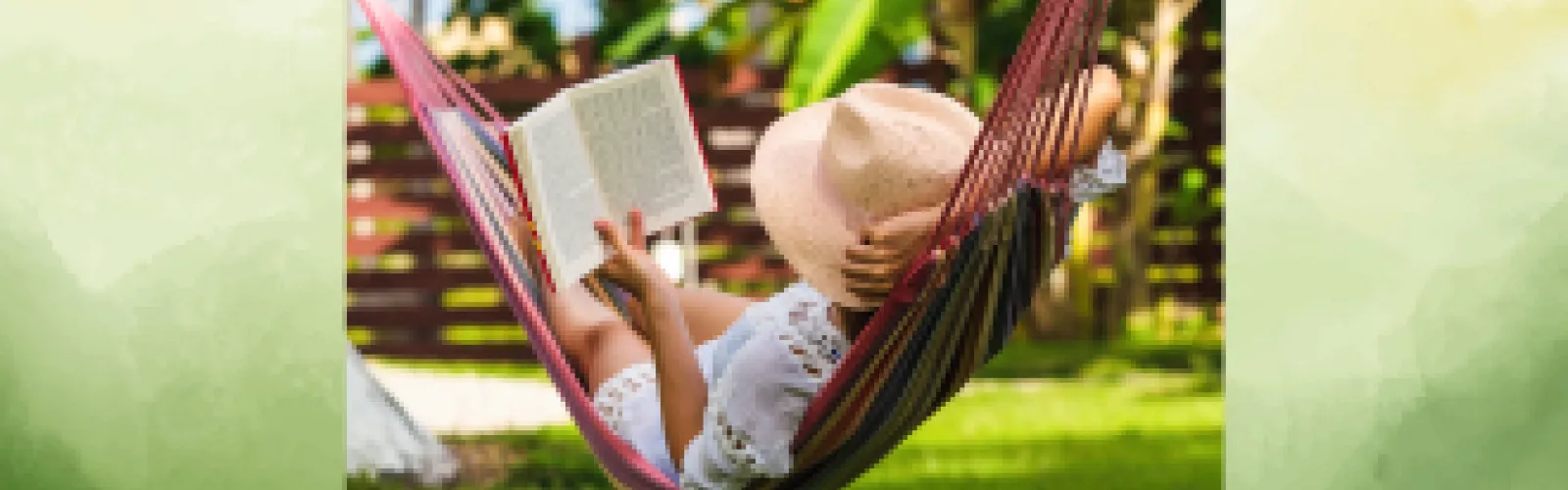 A person relaxing in a hammock outdoors while reading a book, link takes you to additional reading challenge information.